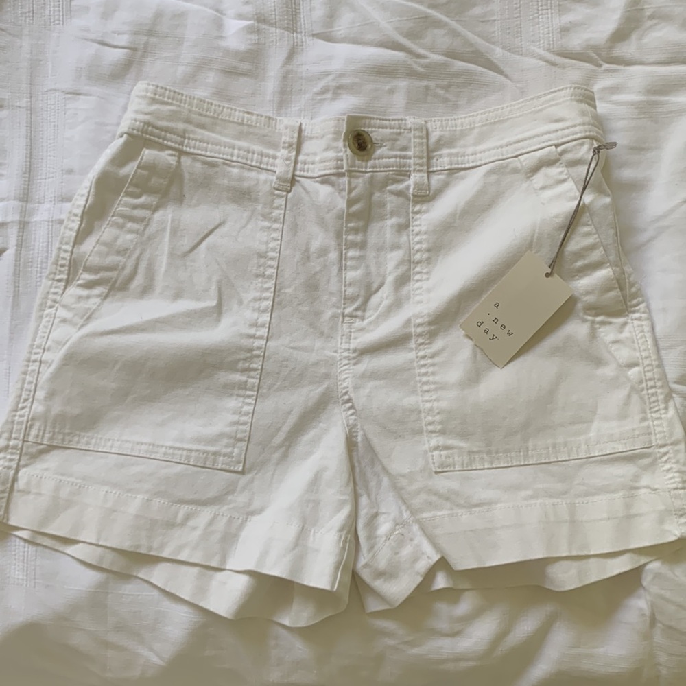 Adorable and comfy white cargo type shorts. NWT. Never worn.